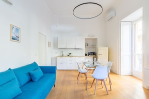 City Apartment | Living area | 35-inch flat-screen TV with digital channels - Piazza Amedeo Flat by Wonderful Italy (Naples)