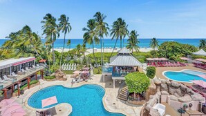 A resort with a large pool, beach view, and palm trees. - Alexander Hotel (Miami Beach)