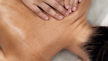 A person receiving a back massage.
