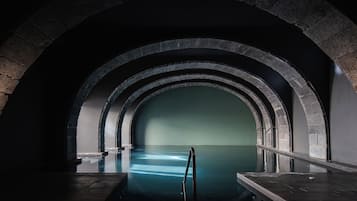 Indoor pool, open 9:00 AM to 9:00 PM, pool loungers