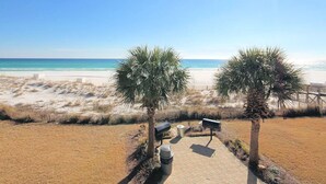 A beach view with two palm trees, a pathway, and a bench. - 🌊Private Pool-FREE Beach Service-Near Beach in Windancer--3BR Aloha Cottage🌺 (Miramar Beach)