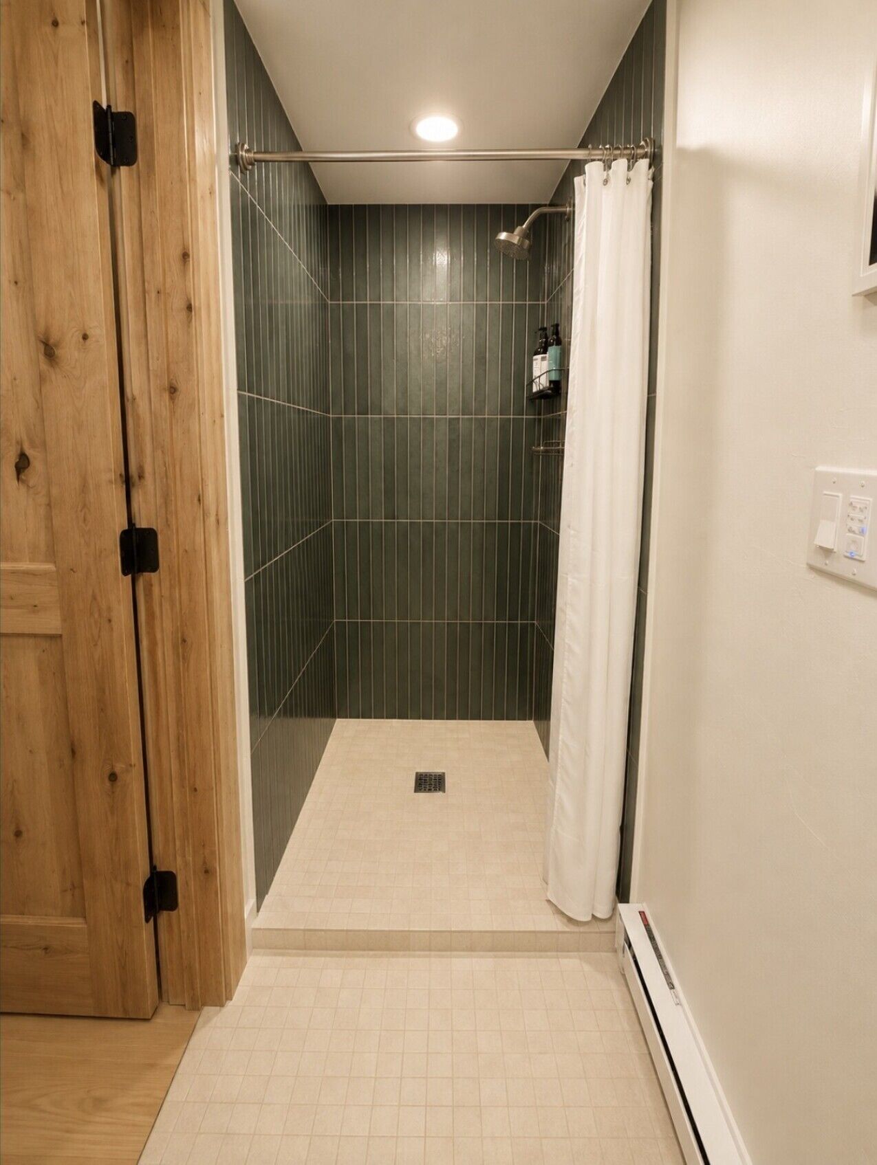 Refresh in the beautifully tiled walk-in shower with a clean, modern design.
