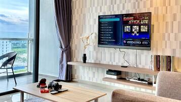 Classic Apartment, 1 Bedroom, Accessible, Partial Sea View | Living area | 48-inch Smart TV with cable channels, video game console, Netflix
