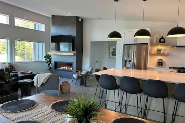 Upstairs open concept living space with high ceilings and stunning ocean views.