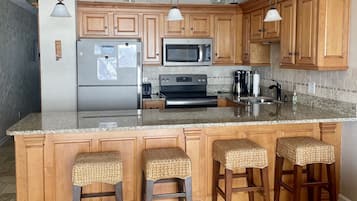 Coffee/tea maker, fridge, microwave, oven