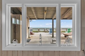 Step through to your private waterfront deck where the sea stretches endlessly before you, Adirondack chairs await lazy afternoons, and the sound of gentle waves becomes your daily soundtrack.