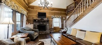 Beautiful hand hewn log cabin called the BlueBeary Bungalow. 