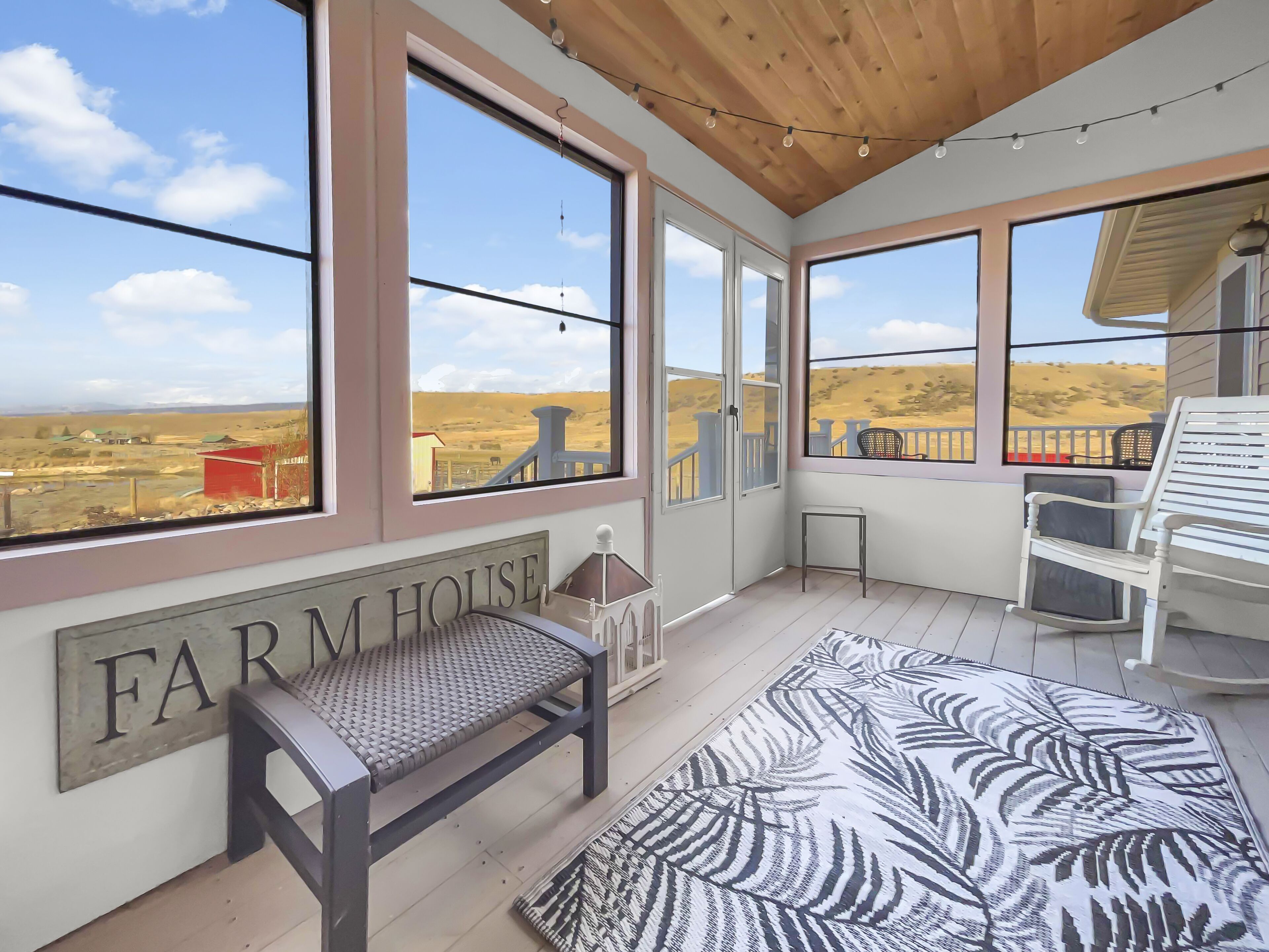Relax on the enclosed porch with awesome views
