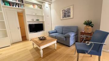 Superior Suite | Living area | 40-inch Smart TV with cable channels