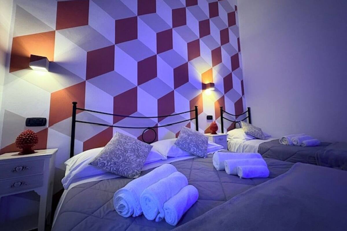 Chambre Triple Supérieure | Draps italiens Frette, literie de qualité supérieure