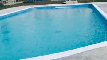 Relax by the rectangular pool surrounded by a spacious deck.