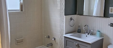 Eco-friendly toiletries, hair dryer, towels, toilet paper