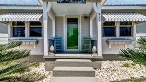 A building with a sign reading "THE BEACH BOX" and a number "500" on the facade. - The Beach Box is located in the heart of CB, walking distance to the boardwalk! (Carolina Beach)