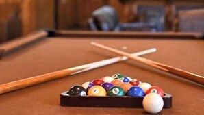 A billiards table with balls and cues in a room with wooden walls and ceiling. - #25Son’s Rio Cibolo Deluxe Safari Cabin (Marion)