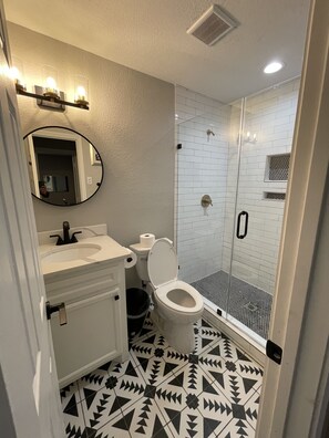 Shower, hair dryer, towels, soap