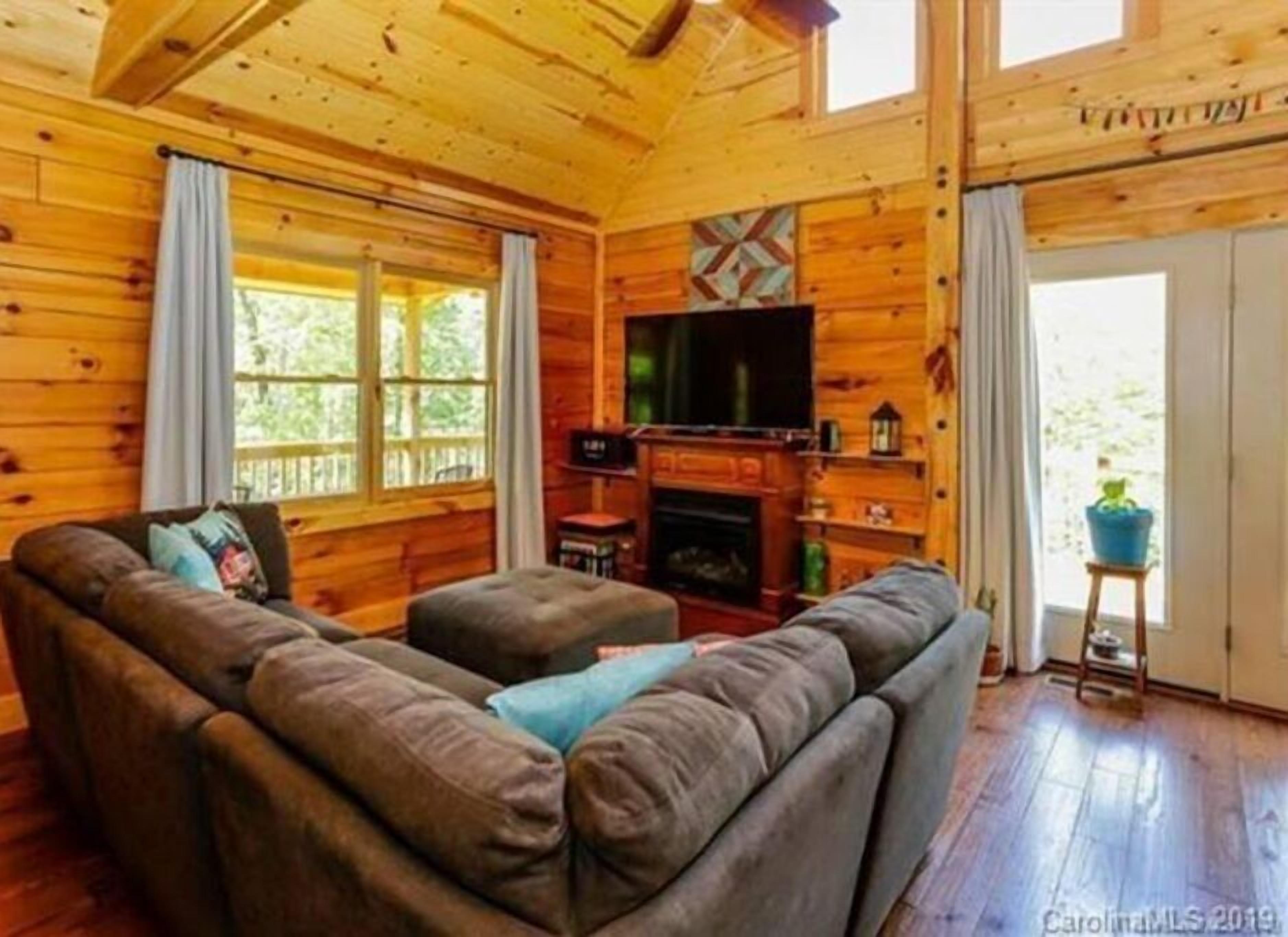 Smart TV, fireplace, books, computer monitors