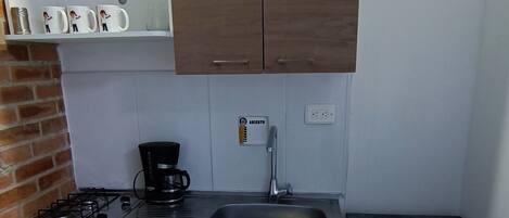 Fridge, microwave, stovetop, coffee/tea maker