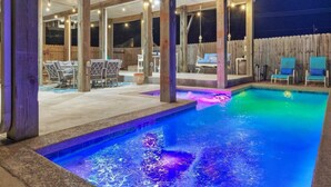 A swimming pool with a wooden deck and lounge chairs. - Priv Pool, Walk to Marina + Eateries, 3 Mins to Beach Marlin Azul by Avantstay (Port Aransas)