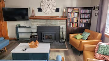 Smart TV, fireplace, DVD player, books