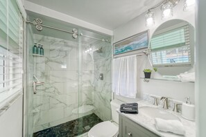 Shower, hair dryer, towels, soap