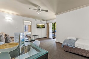 Family Suite | Living area | 42-cm LCD TV with cable channels