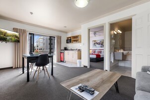 Deluxe Suite | Living area | 42-cm LCD TV with cable channels