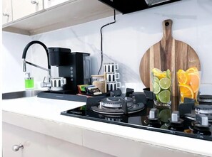 Fridge, microwave, stovetop, coffee/tea maker