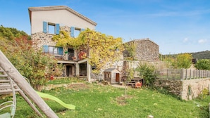 A stone building with a flat roof and a balcony with blue shutters. - Stunning home in Darbres (Darbres)