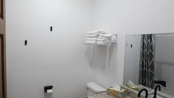 Basic Room, 1 King Bed, Accessible | Bathroom | Shower, hair dryer, towels, soap