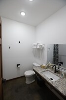 Basic Room, 1 King Bed, Accessible | Bathroom | Hair dryer, towels, soap, shampoo