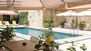 Breakfast, lunch served; local and international cuisine, pool views
