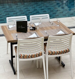 Breakfast, lunch served; local and international cuisine, pool views 