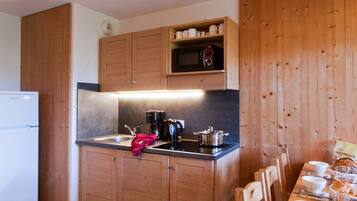 Microwave, dishwasher, dining tables