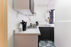 Fridge, stovetop, coffee/tea maker, cookware/dishes/utensils