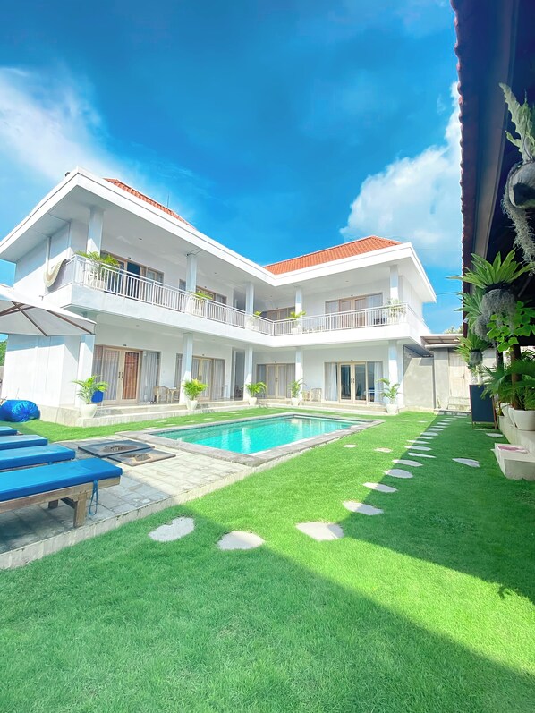 Enjoy a relaxing stay in this two-story home with a pool and beautifully landscaped backyard.