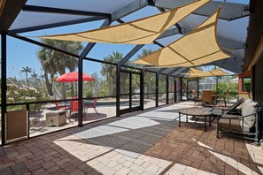 Outdoor dining - Villa Albatross- Gorgeous Ground Level Pool Home in the Dunes (Sanibel)
