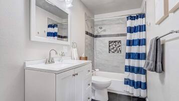 Shower, hair dryer, towels, shampoo