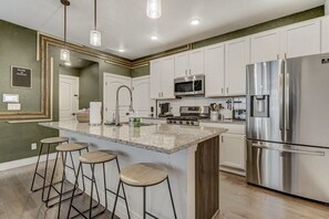 Fridge, microwave, oven, stovetop - Rocky Retreat! Family Townhome w/ BBQ & Workspace (Colorado Springs)