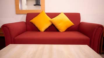 Deluxe Apartment | Living room | 32-inch LCD TV with cable channels