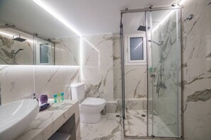 Apartment | Bathroom | Rainfall showerhead, slippers, towels
