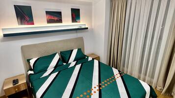 Departamento | 1 habitación, tabla de planchar con plancha, wifi gratis y ropa de cama