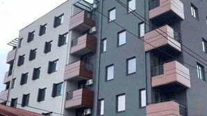 A multi-story residential building with balconies, a flat roof, and a modern architectural design. - Brand new 2 Bedroom Apartment in the Center Skopje (Skopje)