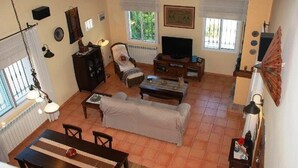 A cozy living room with a sofa, TV, and dining area. - SAONA VILLAS (VN SILKA): villa 6 people, private pool, wifi (L'Ametlla de Mar)