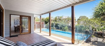 Victoria’s Poolside Emerald Beach stay with Shared Pool, Near Beach and Cafes.