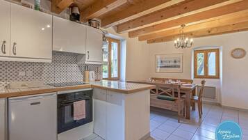 Fridge, oven, toaster, dining table