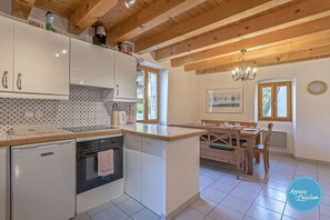 Fridge, oven, toaster, dining tables
