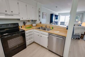 Fridge, microwave, oven, stovetop - Coastal Beachfront Getaway Poolside and Oceanfront (North Myrtle Beach)