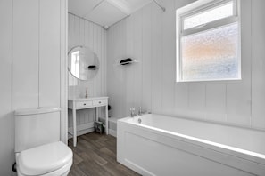 A modern bathroom with a toilet, sink, and bathtub. - Super Comfortable & High Quality (Cleethorpes)