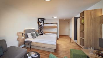 A modern hotel room with a bunk bed, a small sofa, a round table, and a wooden bookshelf.