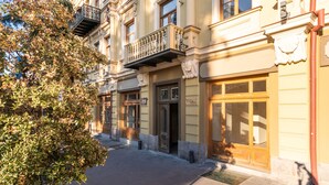 A historic building with ornate balconies, large windows, and a classic architectural style. - H&B apartments Atoneli (Tbilisi)
